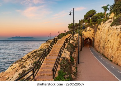 Tunnels of the Cantal, between Rincon de la Victoria and Cala del Moral, Malaga, promenade that runs through tunnels and cliffs facing the Mediterranean. - Shutterstock ID 2260528689