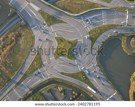 Turbo traffic square roundabout, Westerleeplein in Maasdijk. Aerial drone view. Complex intersection.