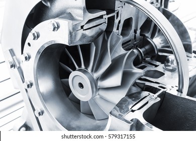 Turbocharger structure illustration with cross section, blue toned photo with soft selective focus