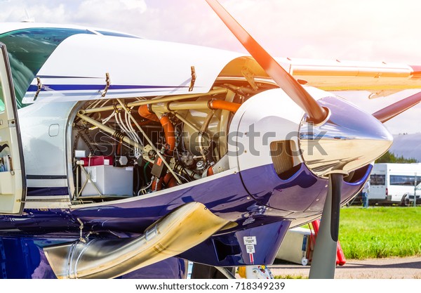 Turboprop airplane aircraft a
propeller chrome luster with open bonnet repair, engine
check