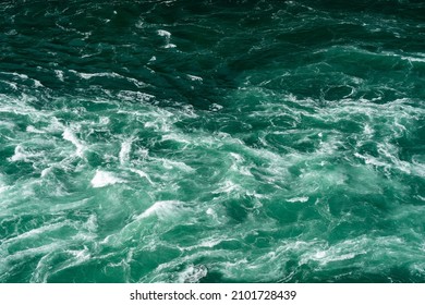 A Turbulent Background Of Turquoise Colored Water Aerial.