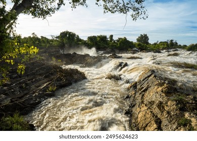 Turbulent Mekong Waters on Don Khon Island, Laos: Sunset Over Li Phi Somphamit Waterfalls - Powered by Shutterstock