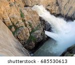 the turbulent water of the shoshone river flowing through the buffalo bill dam, near cody,  wyoming