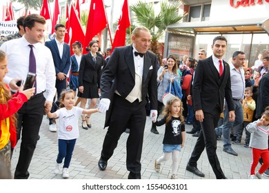 Turgutlu Manisa Turkey 10 29 2018 The Republic Day In Turkey.29 Ekim. Dressed Up Man Ataturk With Children Crossing The Street In The Celebration. 