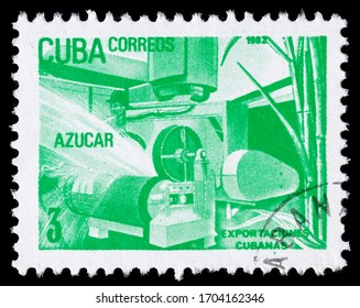 TURIN, ITALY - APRIL 14, 2020: A Stamp Printed In CUBA Celebrating Export Industry And Showing Image Of A Sugar Processing Plant, Exports Series, Circa 1982