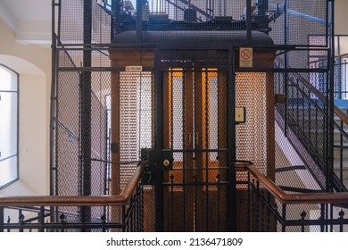 TURIN, ITALY - August 21, 2021: Antique Wooden Elevator In A Metal Shaft.