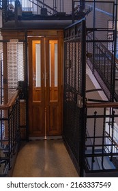 TURIN, ITALY - August 21, 2021: Antique Wooden Elevator In A Metal Shaft.