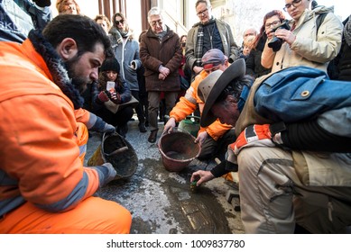 TURIN, ITALY - JANUARY 18, 2018: Artist Gunter Demnig Lays One Of His Stumbling Blocks At The 'Memory Blocks' Performance In Turin, Italy. He Started  In 1996 To Remember The Victims Of Nazism.