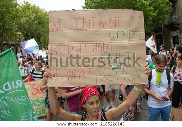 TURIN, ITALY\
- JULY 29, 2022: Young people protest during the Climate Social\
Camp March on July 29, 2022 in Turin, Italy. Fridays For Future is\
a global climate strike\
movement.
