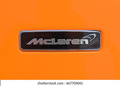 TURIN, ITALY - JUNE 10, 2017: McLaren logo on a orange body car