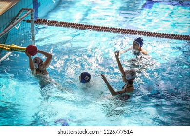 Turin, Italy - June 2017: Kids Playing Water Polo In A Swimming Pool