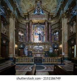 Turin, Italy - March 2022: An interior view of the Maria Ausiliatrice Sanctuary, with a closeup of the Don Bosco's urn