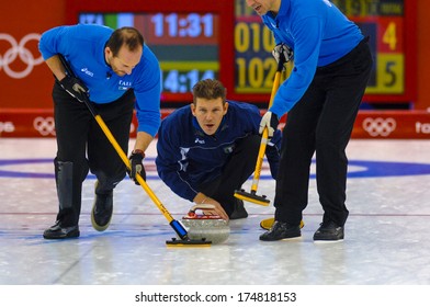 TURIN, ITALY-FEBRUARY 19, 2006: Italian male team in action during the Winter Olympic Games of Turin 2006.