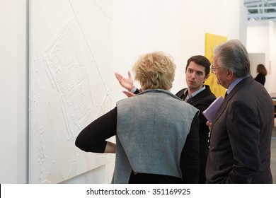 TURIN - NOVEMBER 6: Artissma, Contemporary Art Fair Opening With People, Galleries And Art Collectors On November 6, 2015 In Turin, Italy. Couple Listening Man Talking About Artworks.