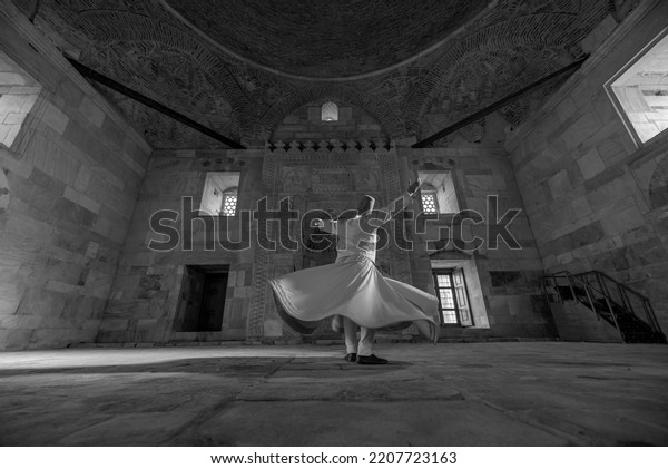 Aydın,\
Turkey - 02 04 2022: Whirling dervish, who serve Mevlevi as a\
religious belief, performs whirling\
dervishes.