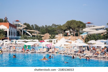 Turkey, Antalya, Lara Beach - July 9, 2022:  Lots Of Sun Beds By The Pool In Lara Beach Topkapi Palace Hotel. People Relaxing By The Pool