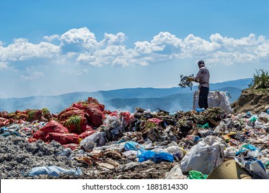 Turkey - April 23 2018: AView Of Garbage Field In Trash Dump Or Open Landfill, Food And Plastic Waste Products Polluting In A Trash Dump, Workers Hands Sorting Garbage For Recycling.