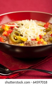 A turkey based "white chili" topped with cheese and peppers