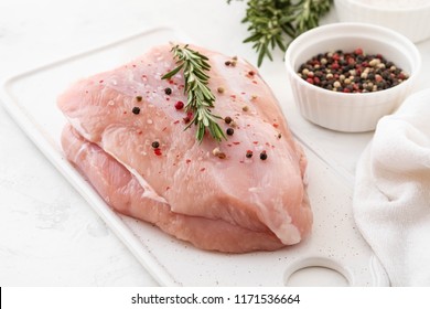 Turkey Breast Raw Meat With Spices On A Dark Background. Copy Space.