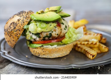 Turkey burger with avocado and chips - Powered by Shutterstock