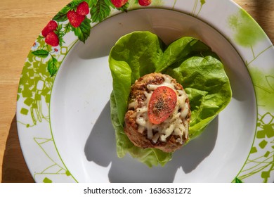 Turkey Burger Lettuce Wrap On Flowered Plate ( Dramatic)