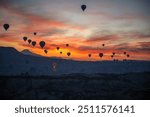 Turkey Cappadocia big tourist attraction - balloon flight. Cappadocia is recognized worldwide as one of the best places to fly with hot air balloons. Balloons in Cappadocia at sunset.