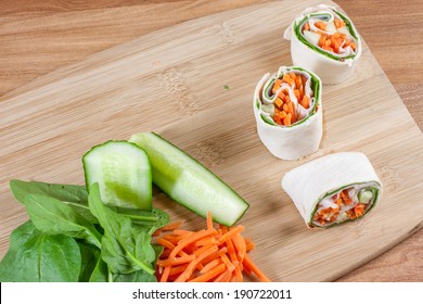Turkey, carrot, spinach, and cucumber pinwheel wraps.