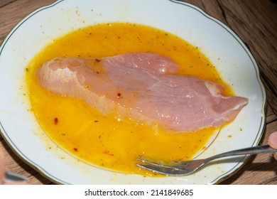 Turkey escalopes in egg yolk for breading