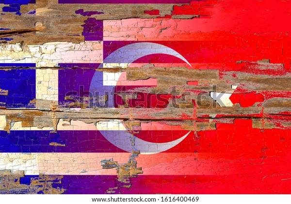 turkey and greece flag on\
old wood.