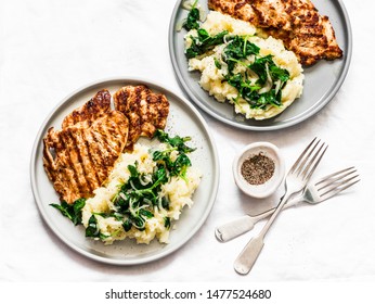 Turkey Grilled Chop And Mashed Potatoes With Creamy Spinach On A Light Background, Top View. Comfort Home Cooked Food