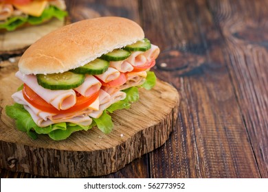 Turkey Ham Sandwich With Cheese, Tomatoes, Cucumbers And Salad