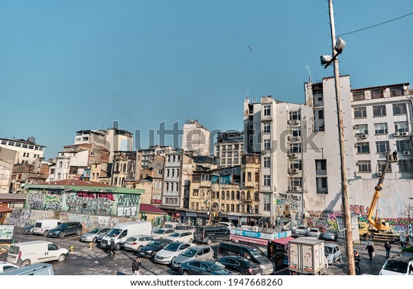 Turkey istanbul 04.03.2021. city\
rural scene by taken photo from Galata bridge to Karakoy shore\
during morning and sunny day. People, bus and cars are\
together.