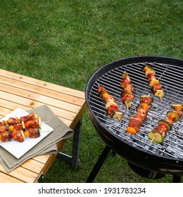 Turkey Kebab On Brazier, Picnic. Barbeque, Bbq Meat. Green Grass Background. Delicious Summer Food. Copy Space.