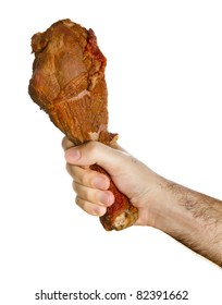 Turkey Leg In Male Hand. Over White.