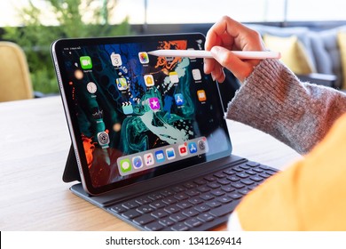 Çanakkale , Turkey - March 03, 2019: Asian Woman Using The New 11 Inch Apple IPad Pro 2018, Swiping Home Screen Or Touching App Icon