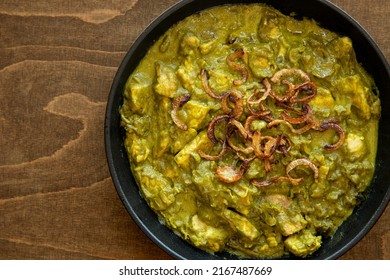 Turkey Meat In Coriander Chutney With Fried Onion. Indian Cuisine Dish.