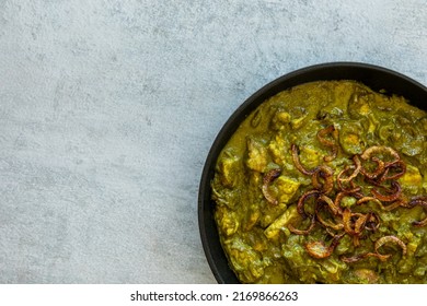 Turkey Meat In Coriander Chutney With Fried Onion. Indian Cuisine Dish.