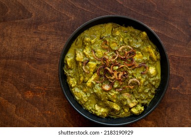 Turkey Meat In Coriander Chutney With Fried Onion. Indian Cuisine Dish.