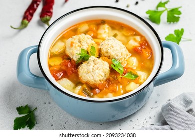 Turkey Meatball Soup In Pot. Copy Space.