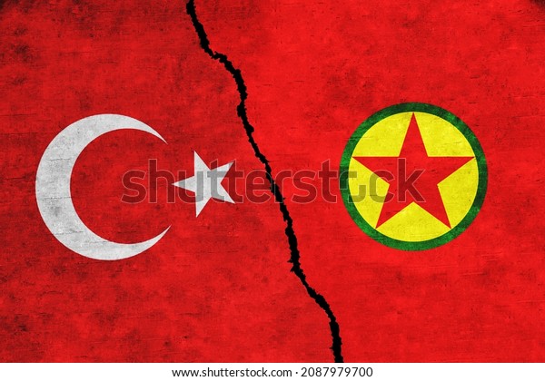 Turkey and\
PKK painted flags on a wall with a crack. Turkey and PKK conflict.\
Turkey and PKK war. Turkey vs\
PKK