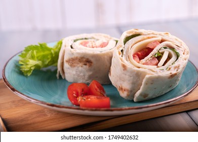 
Turkey Roll Ups With Cheese And Vegetables,
Close-up Of Delicious Appetizer.
Tortilla Pieces.