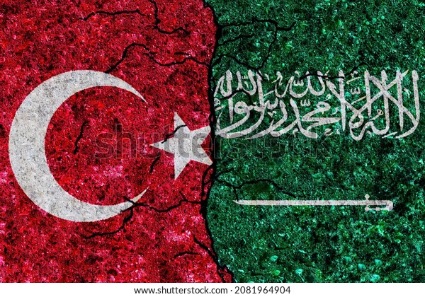 Turkey and Saudi Arabia\
painted flags on a wall with grunge texture. Turkey and Saudi\
Arabia conflict. Saudi Arabia and Turkey flags together. Turkey vs\
Saudi Arabia