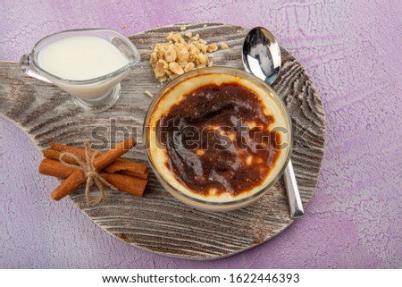 Turkish and Arabic traditional Ramadan dessert Baked Rice pudding is a dish made from rice mixed with water, milk,sugar and other ingredients such as cinnamon and raisins. Foto stock © 