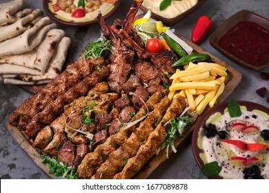 Turkish and Arabic Traditional Ramadan Mix Vali Kebab Plate inside Adana, Urfa, Chicken, Lamb, Liver and Beef on bread 
				