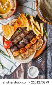 Turkish and Arabic Traditional Ramadan Mix Vali Kebab Plate inside Adana, Urfa, Chicken, Lamb, Liver and Beef on bread
Arabic grilled arabic food dishes shish kebab, chicken shish kebab
