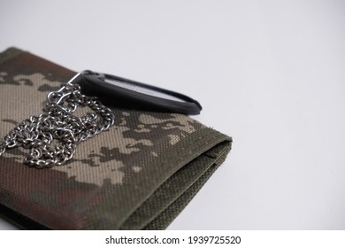 Turkish Army military tag for turkish soldiers. White background. selective focused photos. isolated. empty space for text. Green army decoreated wallet for mendotary military service. - Shutterstock ID 1939725520