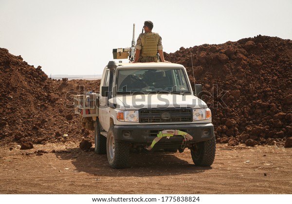 A Turkish army\
soldier sits on his military vehicle opposite ISIS areas.\
Aleppo,\
Syria 15 September 2017
