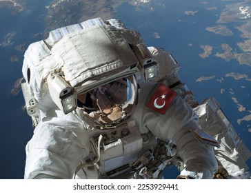 Turkish astronaut and world in the background. Elements of this image furnished by NASA. - Shutterstock ID 2253929441