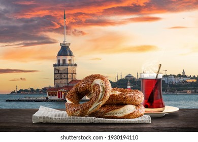 Turkish Bagel Simit with sesame, traditional pastry of Turkey and landscape Istanbul Maidens Tower (Kız Kulesi)