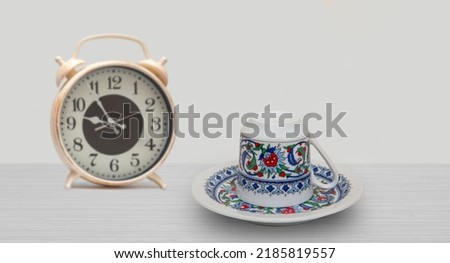 Turkish coffee cup on wooden table. Preparation for coffee fortune telling. Front view